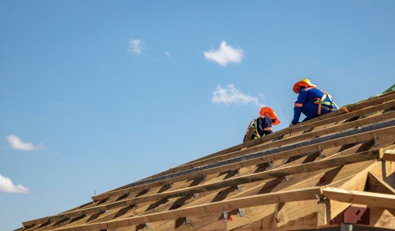 Two roofing contractor working on a commercial roof